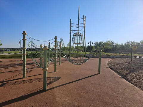 The rope-and-timber climbing structure on the playground at Coal Creek Park