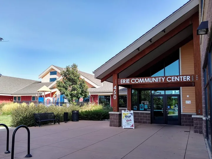 The west entrance of the Erie Community Center, with the playground beyond