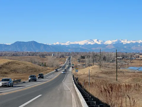Baseline Road, Colorado 7, running west toward the snow-covered Front Range on a December morning