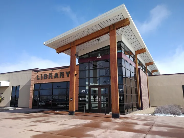 The timber-and-glass entrance of the Erie Community Library