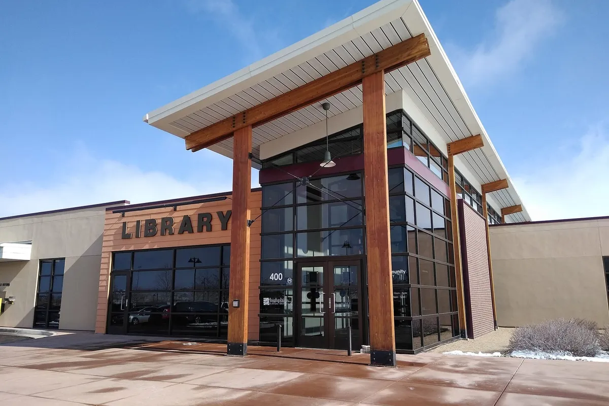 The timber-and-glass entrance of the Erie Community Library