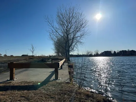 Afternoon sun off the water at Thomas Reservoir, seen from the fishing pier